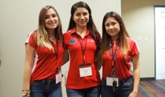 students posing for picture at conference